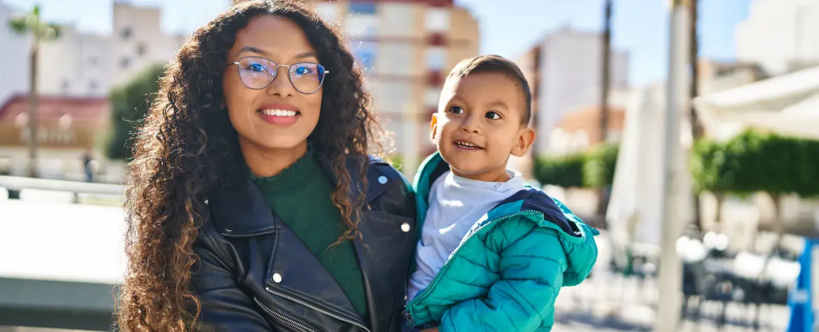 Woman and child smiling at you. Standing up to corporate abuses & keeping families safe for 40 years. Donate today!